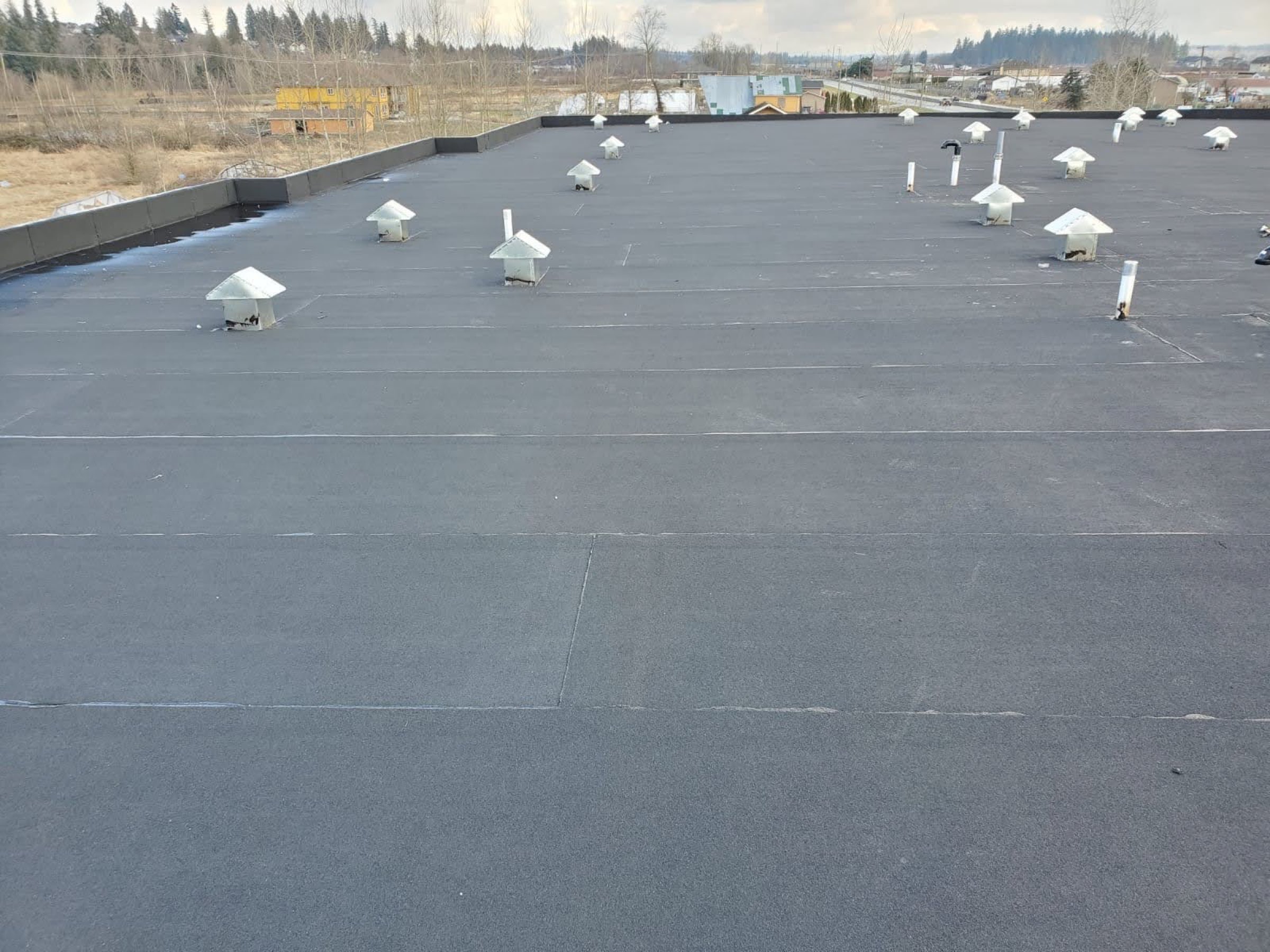 Flat roof installation by Friendly Roofing